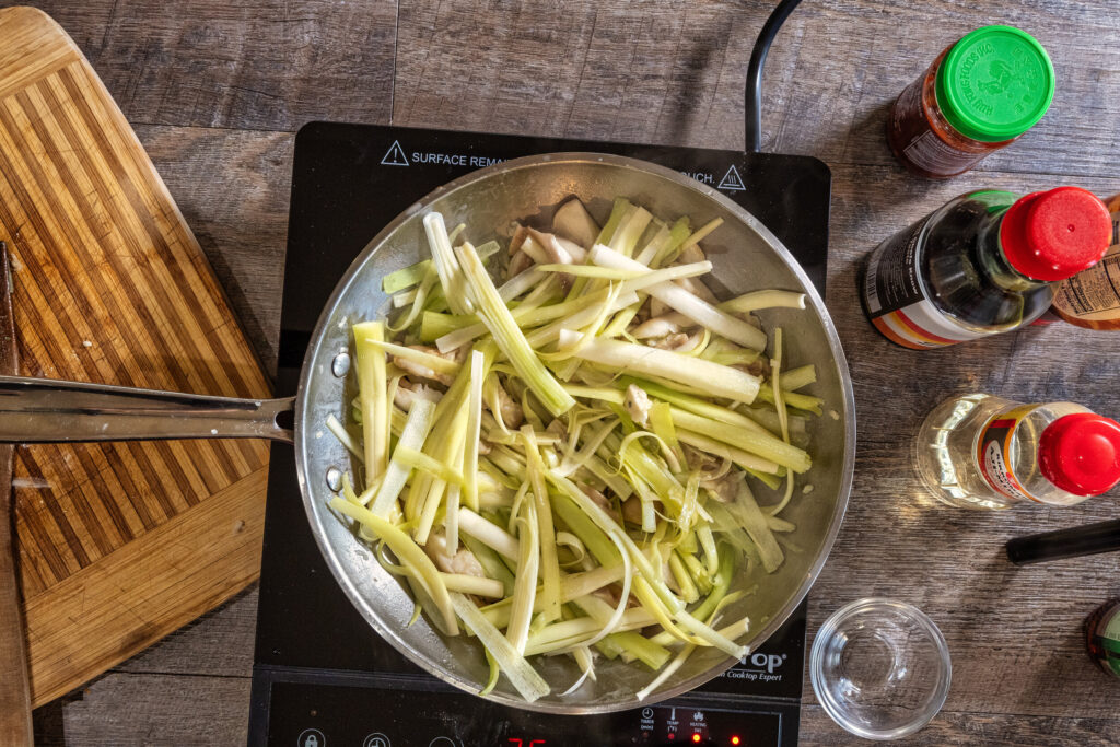 Cattails hearts and oyster mushrooms in the pan.
